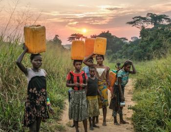 Children carrying water near Yangambi, Democratic Republic of Congo