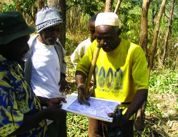 Farmers in Guinea using an aerial map 