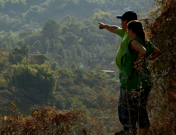 Woman and man overlooking landscape in Peru SPDA
