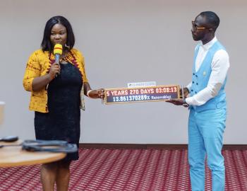 Okyeame Kwame and Portia Adu Mensah pictured with the Climate Clock, Ghana