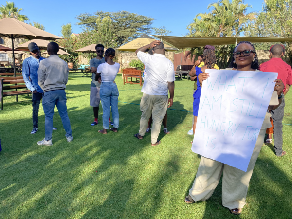 Muungano wa Wanavijiji workshop participants reflect in pairs about what they still would like the workshop to unpack in the remaining time, Nairobi, February 2025