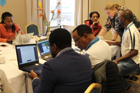 Researchers editing the Climate Change Adaptation Wikipedia article at Africa_s first Wikipedia edit-a-thon on climate change, August 2019. Credit_ CDKN and FCFA