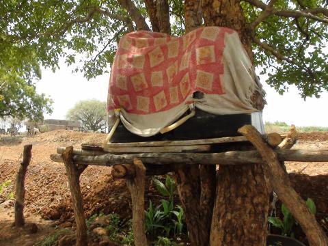 An earthen pot is set beside the road so travellers and passersby can drink cold water throughout the day.