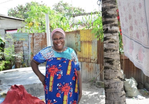 Acheni Athuman Chamguhi (49) has seen her business (making and selling batik fabrics) improve thanks to the accessible weather forecast information shared by the DARAJA project’s solutions (Courtesy of DARAJA)